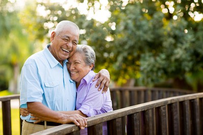 Happy seniors on a tour of a continuing care retirement community