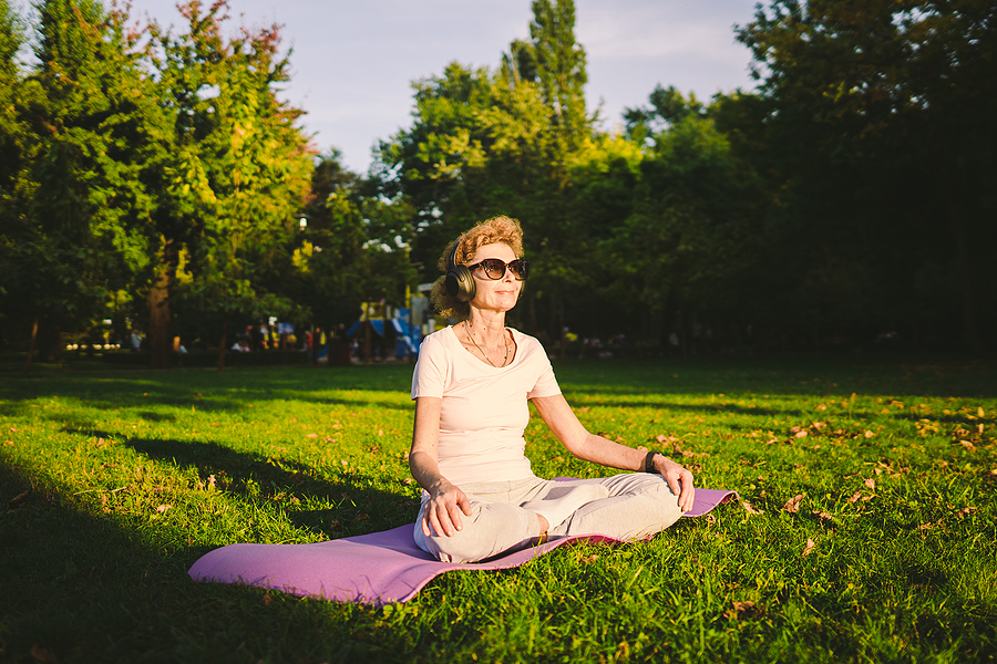woman doing yoga in the park